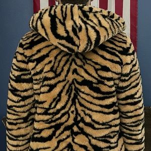 Get ready and cute for the Fall with this Tiger stripped jacket.